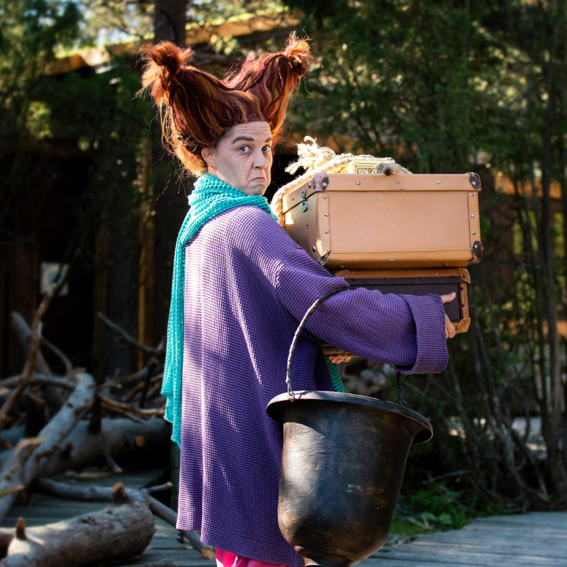 The Witch carrying her stuff